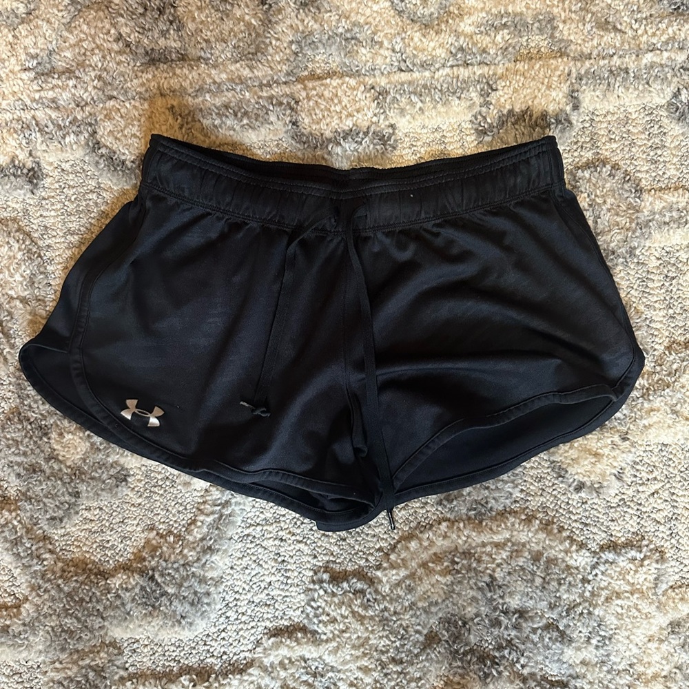 size large black underarmor shorts .